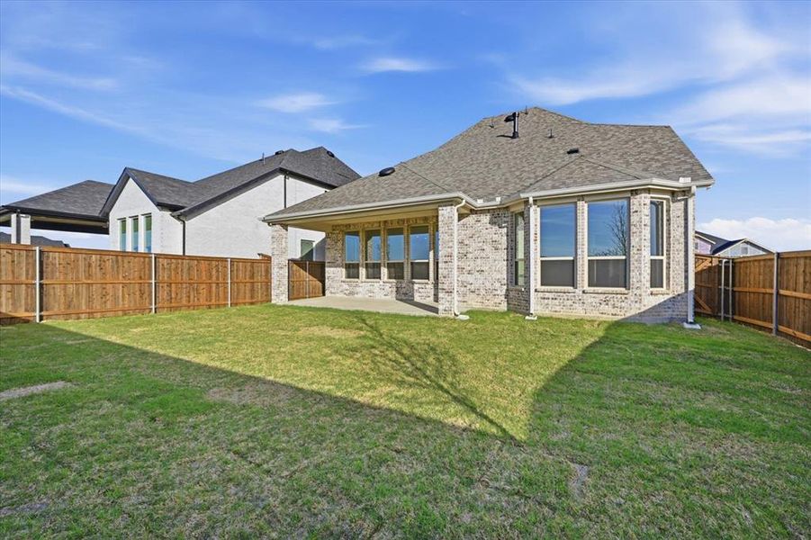 Exterior details and patio area of a home in Cambridge Crossing, Celina (Image 2).