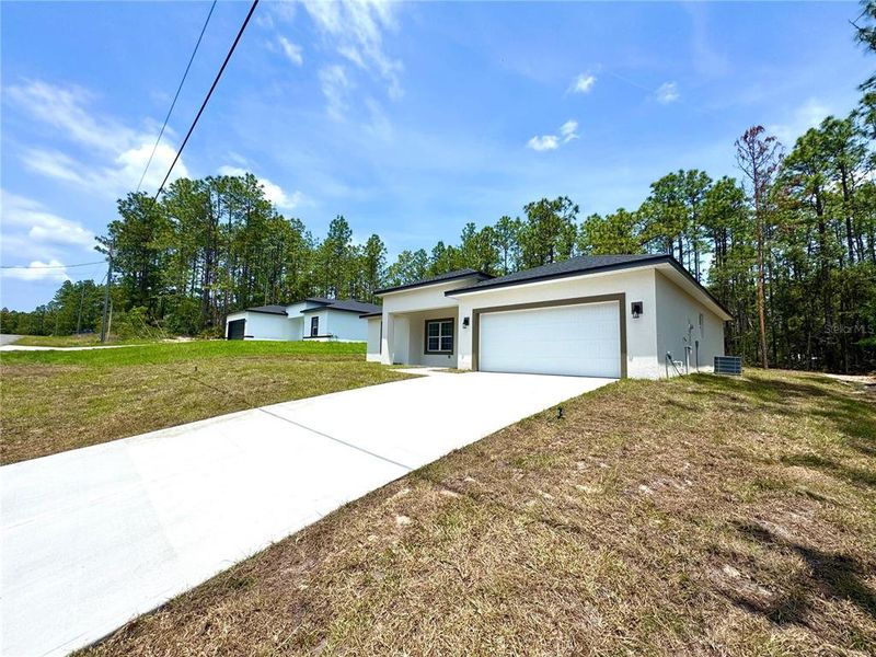Front exterior of a new home in , Citrus Springs, FL, highlighting curb appeal (Image 16).