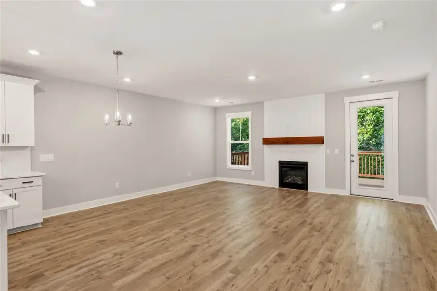 A well-lit gathering space with warm wood flooring A well-lit gathering space with warm wood flooring