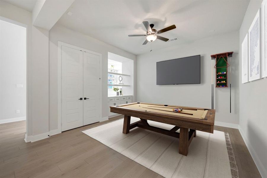 Playroom featuring ceiling fan, light wood-type flooring, and billiards table
