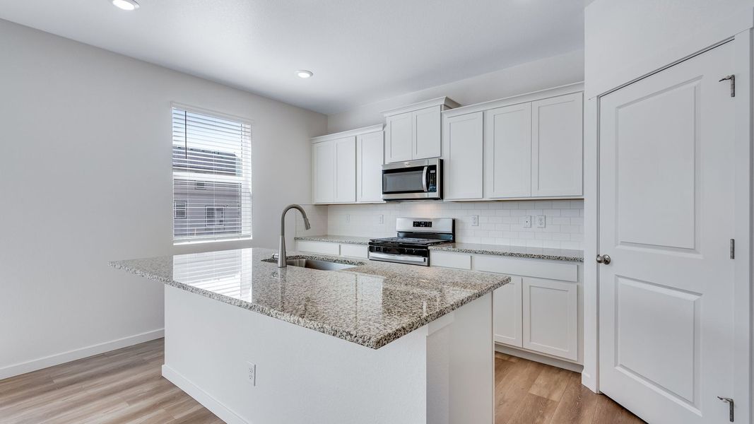 Furnished interior view inside a new home in Trails at Crowfoot, Parker (Image 4).
