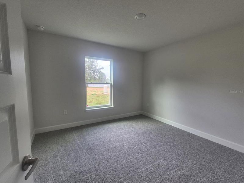Spacious, unfurnished interior of a new home in Hill Country Estates, Dade City (Image 47).