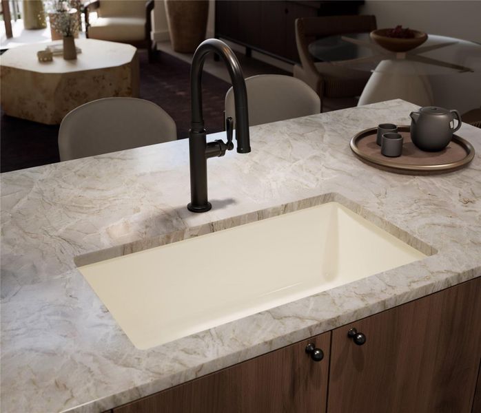 Kitchen with a breakfast bar, hanging light fixtures, wood finished floors, recessed lighting, quartzite countertop and Thermador appliances. Trailhead Palette