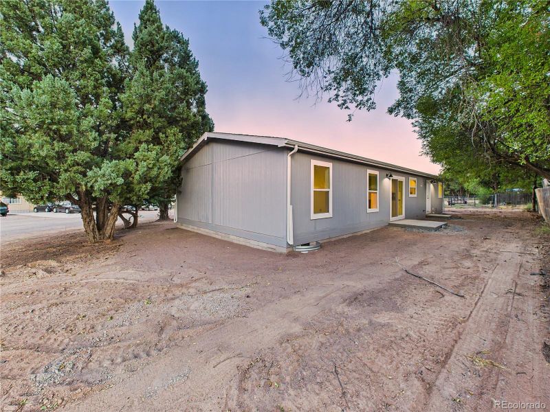 Multiple angles show side and backyard space with potential for landscaping, garden beds, or play areas.