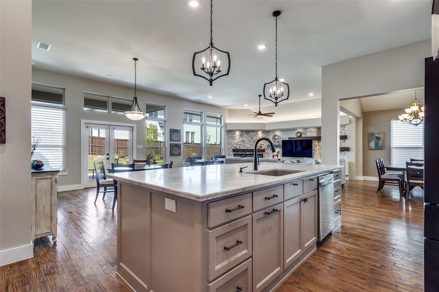 Open and airy kitchen with beautiful pendant lights