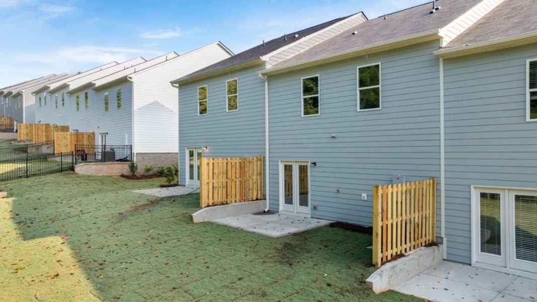 Exterior details and patio area of a home in Waypoint, Flowery Branch (Image 3).