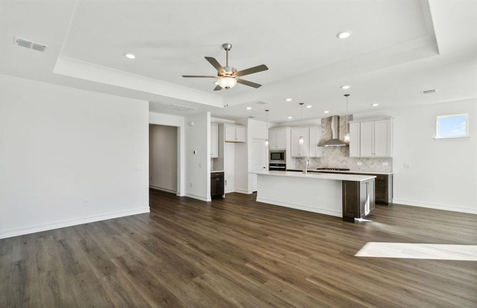 Airy gathering room with Tray ceiling *real home pictured