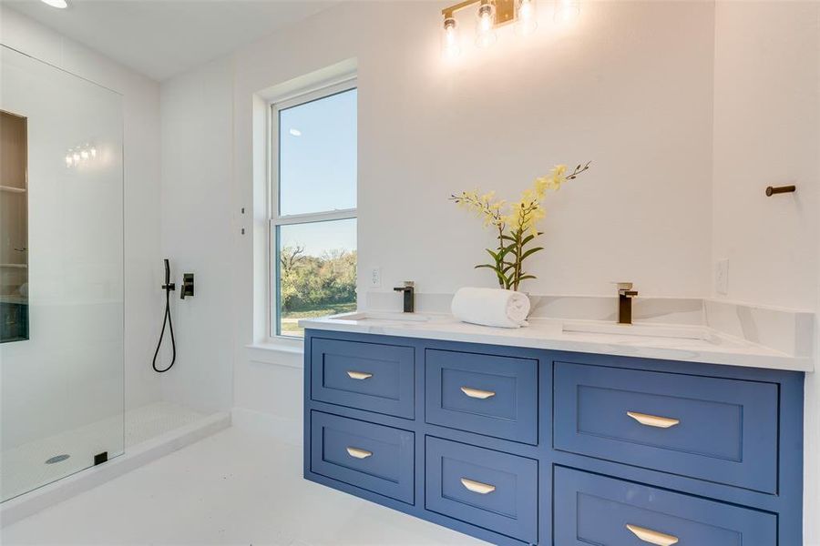 Bathroom featuring vanity and walk in shower