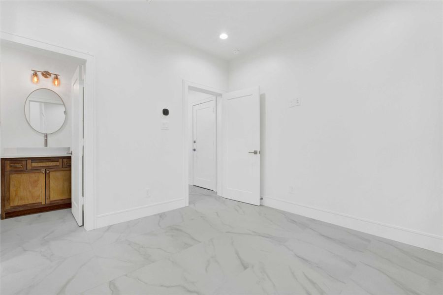 Spacious first-floor en-suite bedroom featuring a separate entrance—ideal for guests, a dedicated office, or potential short-term rental use.