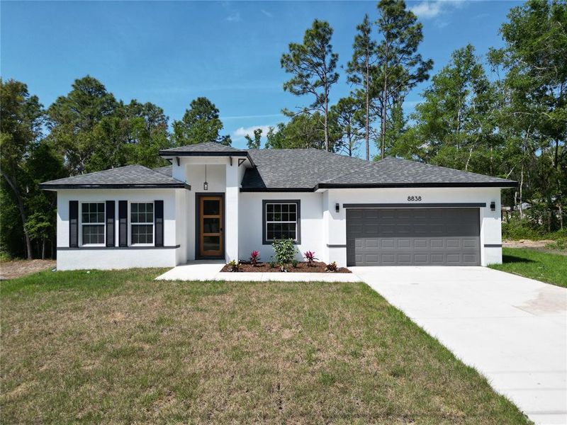 Front exterior of a new home in , Citrus Springs, FL, highlighting curb appeal (Image 16). Front exterior of a new home in , Citrus Springs, FL, highlighting curb appeal (Image 16).