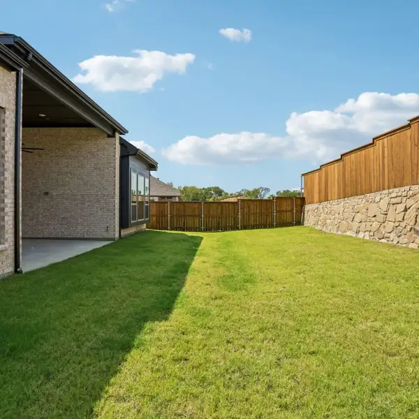Exterior details and patio area of a home in The Parks at Wilson Creek, Celina (Image 32). Exterior details and patio area of a home in The Parks at Wilson Creek, Celina (Image 32).