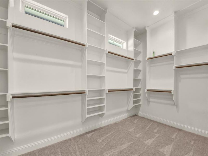 Spacious closet with carpet floors Spacious closet with carpet floors