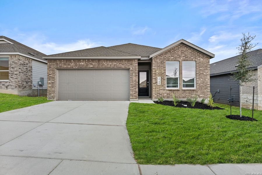 Front exterior of a new home in Brookmill, San Antonio, TX, highlighting curb appeal (Image 1). Front exterior of a new home in Brookmill, San Antonio, TX, highlighting curb appeal (Image 1).