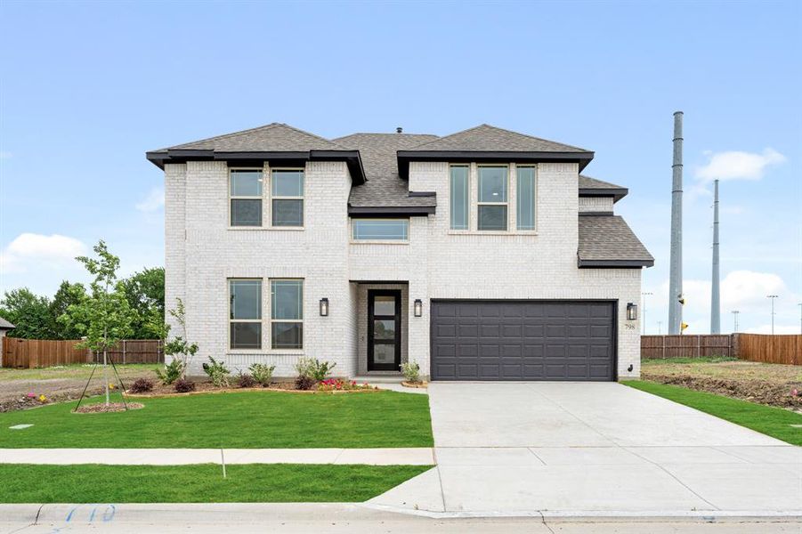 Front exterior of a new home in Grand Heritage, Lavon, TX, highlighting curb appeal (Image 24). Front exterior of a new home in Grand Heritage, Lavon, TX, highlighting curb appeal (Image 24).