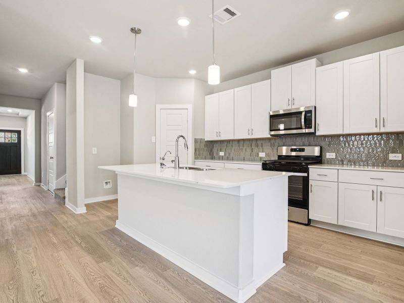 Furnished interior view inside a new home in Sanford Farms - Premier Series, Waller (Image 6).
