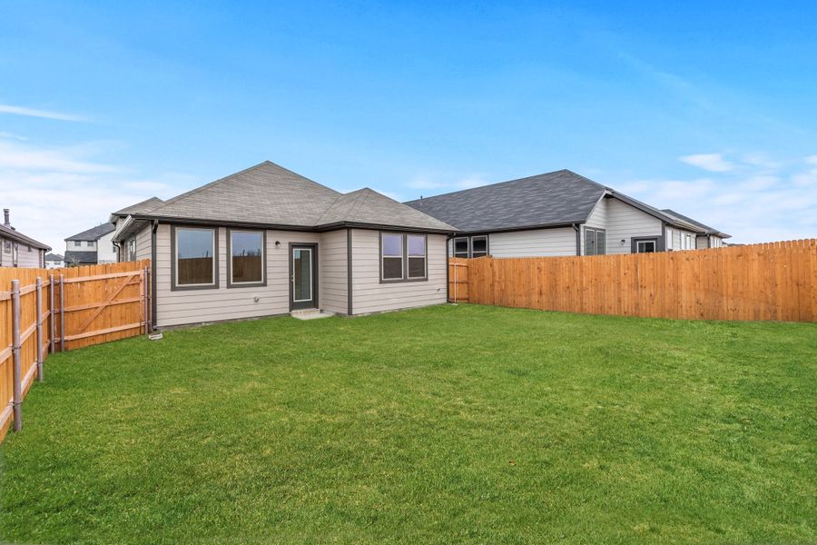 Exterior details and patio area of a home in Trinity Ranch, Elgin (Image 20). Exterior details and patio area of a home in Trinity Ranch, Elgin (Image 20).