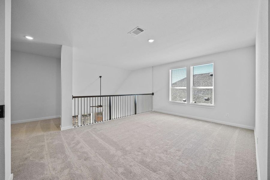 Carpeted spare room featuring recessed lighting Carpeted spare room featuring recessed lighting