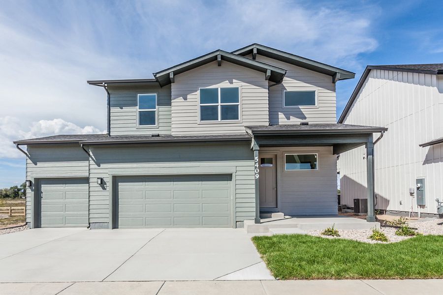 Front exterior of a new home in Prairie Song, Windsor, CO, highlighting curb appeal (Image 26).