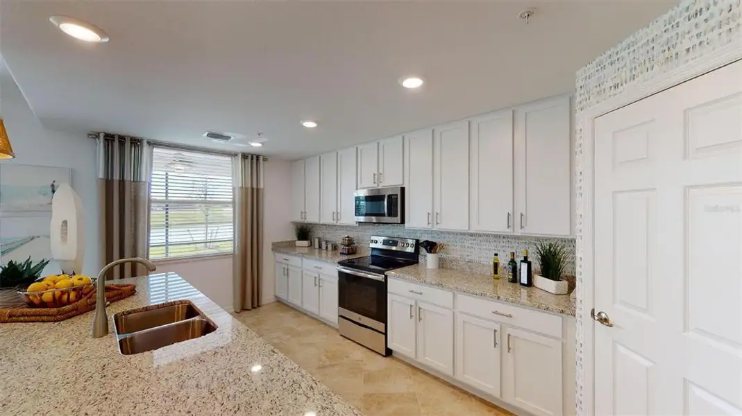 Furnished interior view inside a new home in Wellen Park Golf & Country Club, Venice (Image 4).