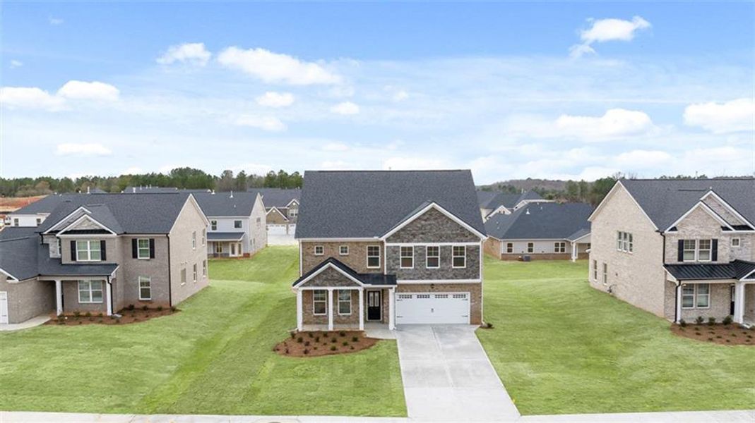 Front exterior of a new home in Westland, Bogart, GA, highlighting curb appeal (Image 1).