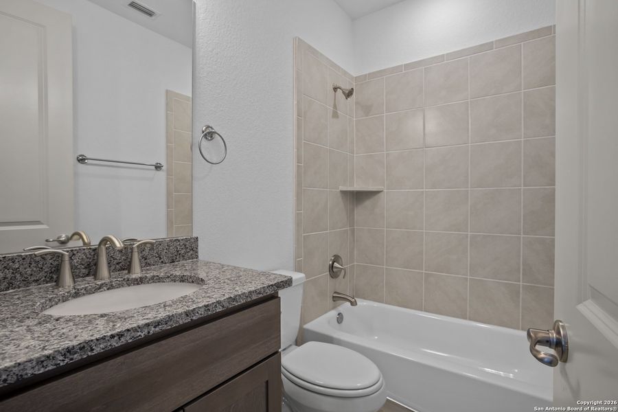 Furnished interior view inside a new home in Highland Estates, San Antonio (Image 8).