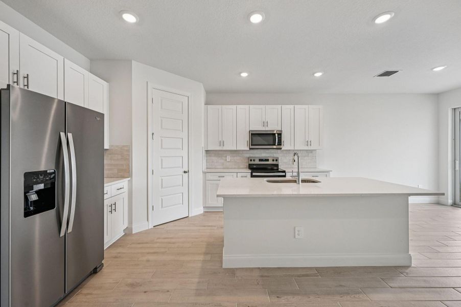 Furnished interior view inside a new home in Brystol at Wylder - Reserve Series, Port St. Lucie (Image 11).