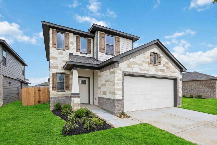 Front exterior of a new home in Bluestem, Brookshire, TX, highlighting curb appeal (Image 2). Front exterior of a new home in Bluestem, Brookshire, TX, highlighting curb appeal (Image 2).