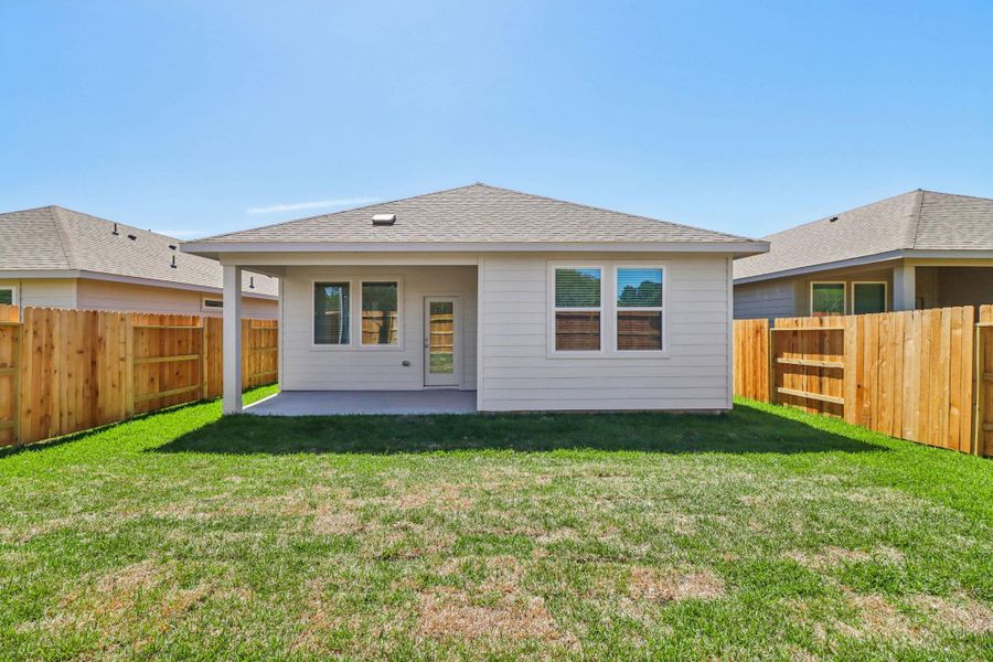 Exterior details and patio area of a home in Sanford Farms - Traditional Series, Conroe (Image 24).