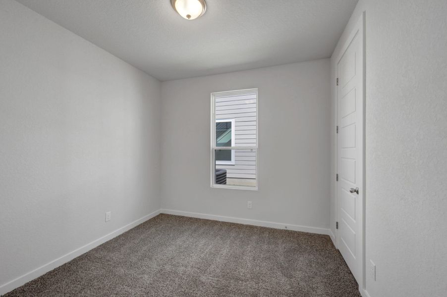 Spacious, unfurnished interior of a new home in The Meadows at Hunters Ranch, San Antonio (Image 40).