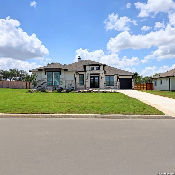 Front exterior of a new home in Megan's Landing, Castroville, TX, highlighting curb appeal (Image 25).