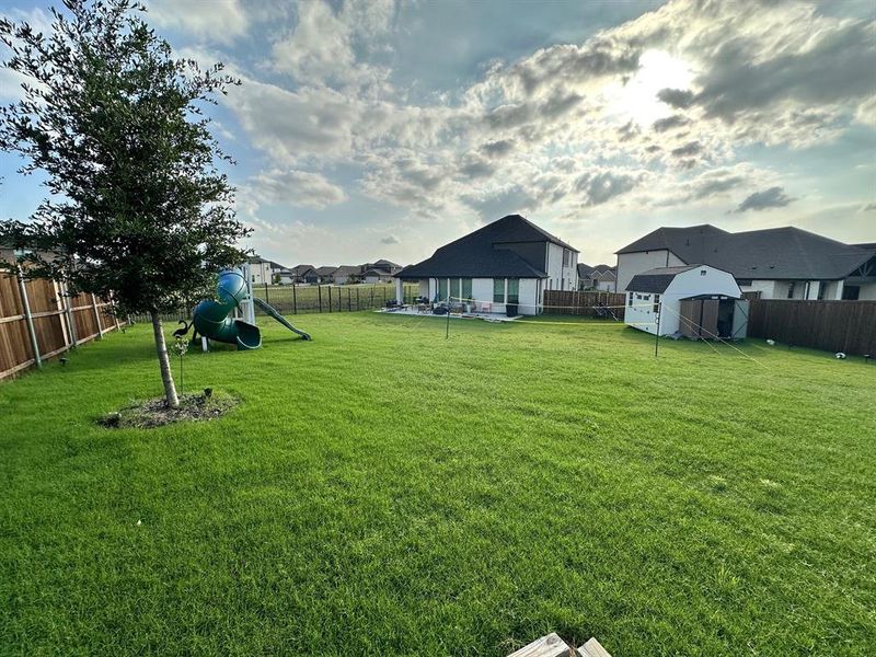 View of yard with a playground and a residential view