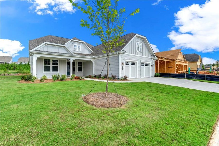 Front exterior of a new home in Cresswind Georgia at Twin Lakes, Hoschton, GA, highlighting curb appeal (Image 1).