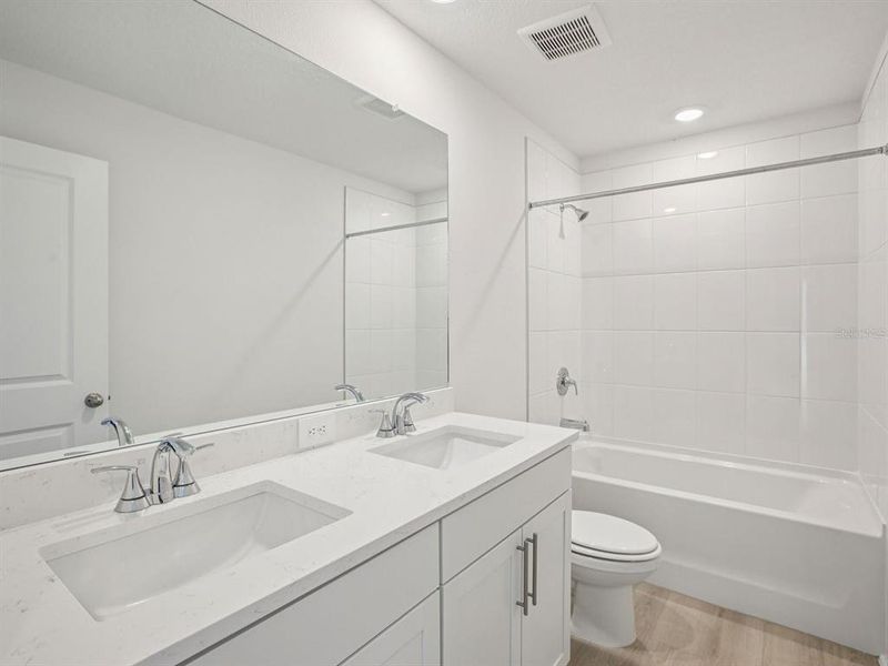 Furnished interior view inside a new home in The Grove at Stuart Crossing - Classic Series, Bartow (Image 15).