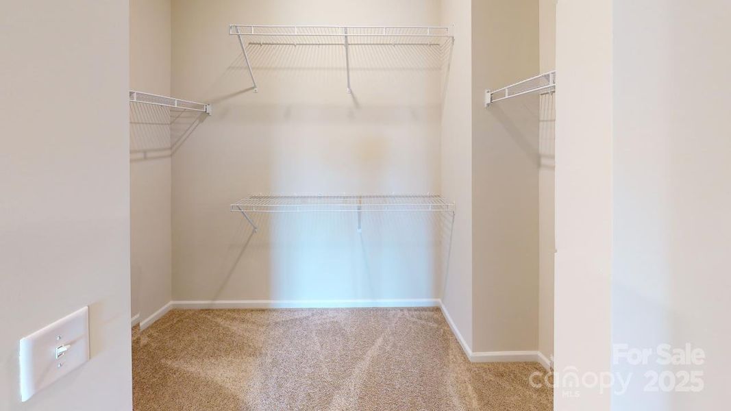 Photos are representational only. - Primary closet Photos are representational only. - Primary closet