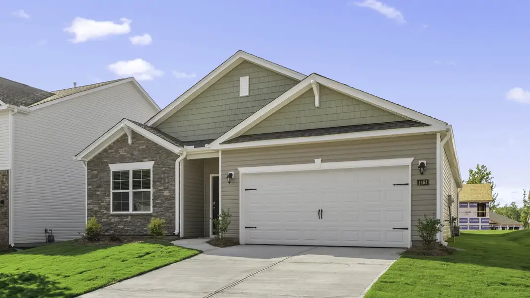 Front exterior of a new home in Colly Farm, Stokesdale, NC, highlighting curb appeal (Image 2). Front exterior of a new home in Colly Farm, Stokesdale, NC, highlighting curb appeal (Image 2).