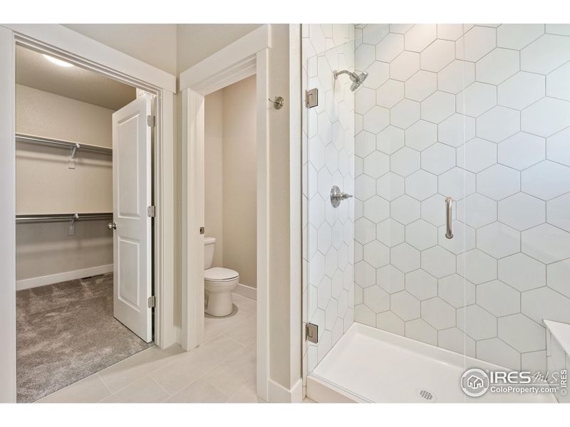 Primary shower. Photos of the actual home.