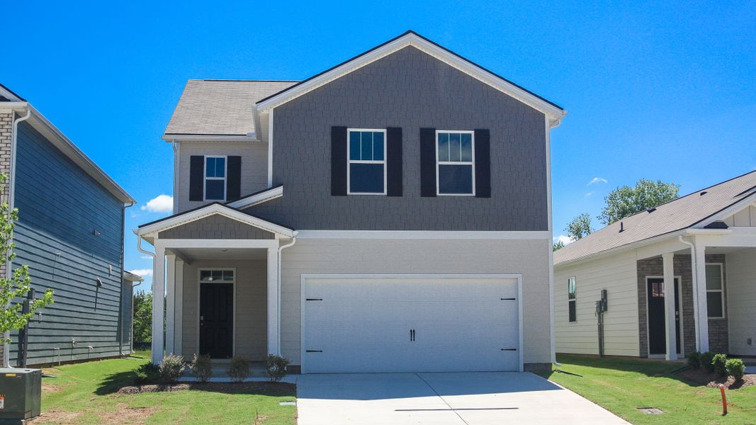 Front exterior of a new home in Paddington Place, Baxter, TN, highlighting curb appeal (Image 1).