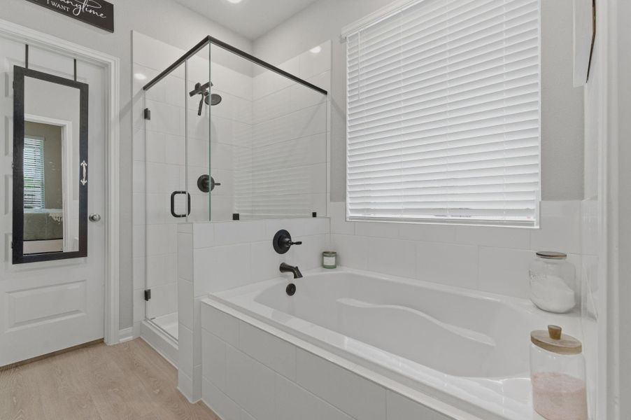 Primary bath with modern shower and tub areas