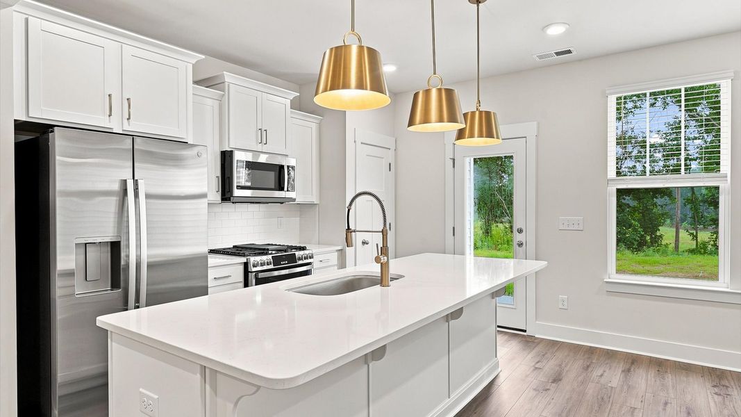 First-class finishes and a thoughtfully scaled island highlight this elegant kitchen space at Ransdell Pointe First-class finishes and a thoughtfully scaled island highlight this elegant kitchen space at Ransdell Pointe