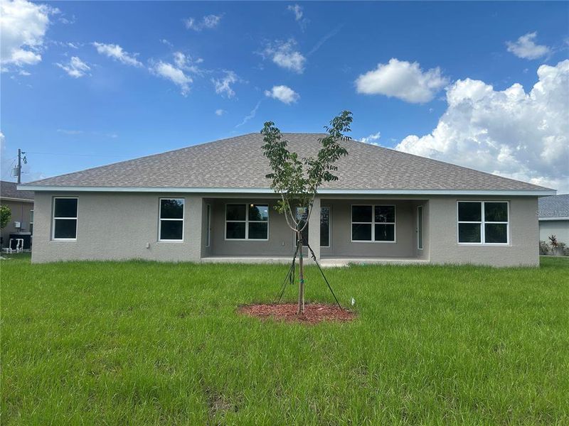 Front exterior of a new home in Deep Creek, Punta Gorda, FL, highlighting curb appeal (Image 2).