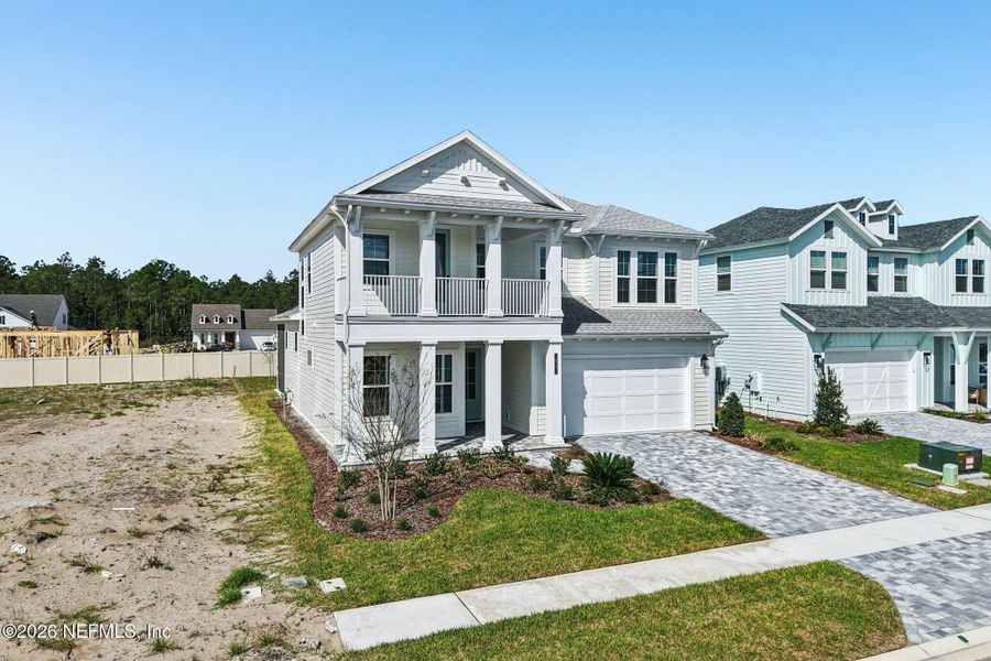 Front exterior of a new home in Nocatee, Ponte Vedra, FL, highlighting curb appeal (Image 33).