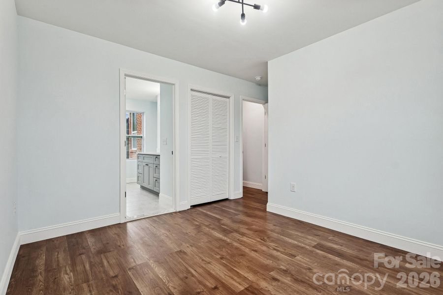 Secondary bedroom facing the rear of home with Jack and Jill full bathroom access
