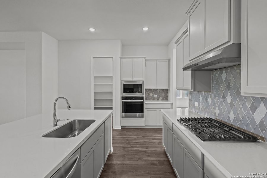 Furnished interior view inside a new home in Homestead 65', Schertz (Image 12).