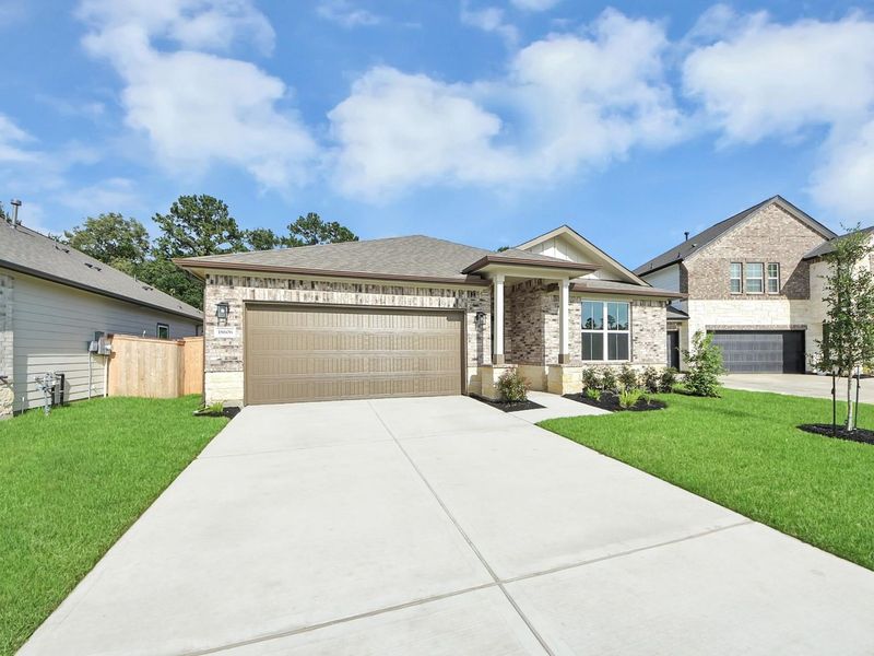 Front exterior of a new home in Sundance Cove, Crosby, TX, highlighting curb appeal (Image 23). Front exterior of a new home in Sundance Cove, Crosby, TX, highlighting curb appeal (Image 23).