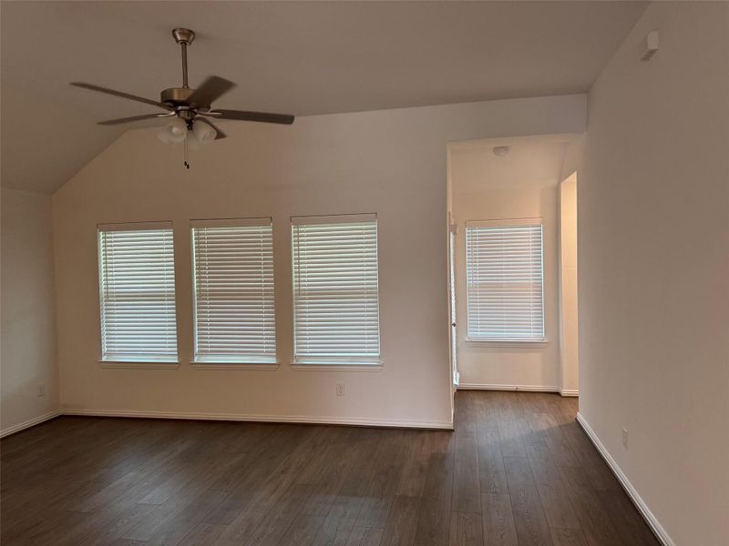 Spacious family room with ceiling fan and abundant natural light overlooks the backyard. Spacious family room with ceiling fan and abundant natural light overlooks the backyard.