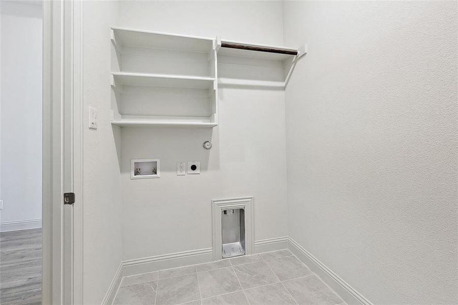 Laundry room with gas dryer hookup, washer hookup, and hookup for an electric dryer Laundry room with gas dryer hookup, washer hookup, and hookup for an electric dryer