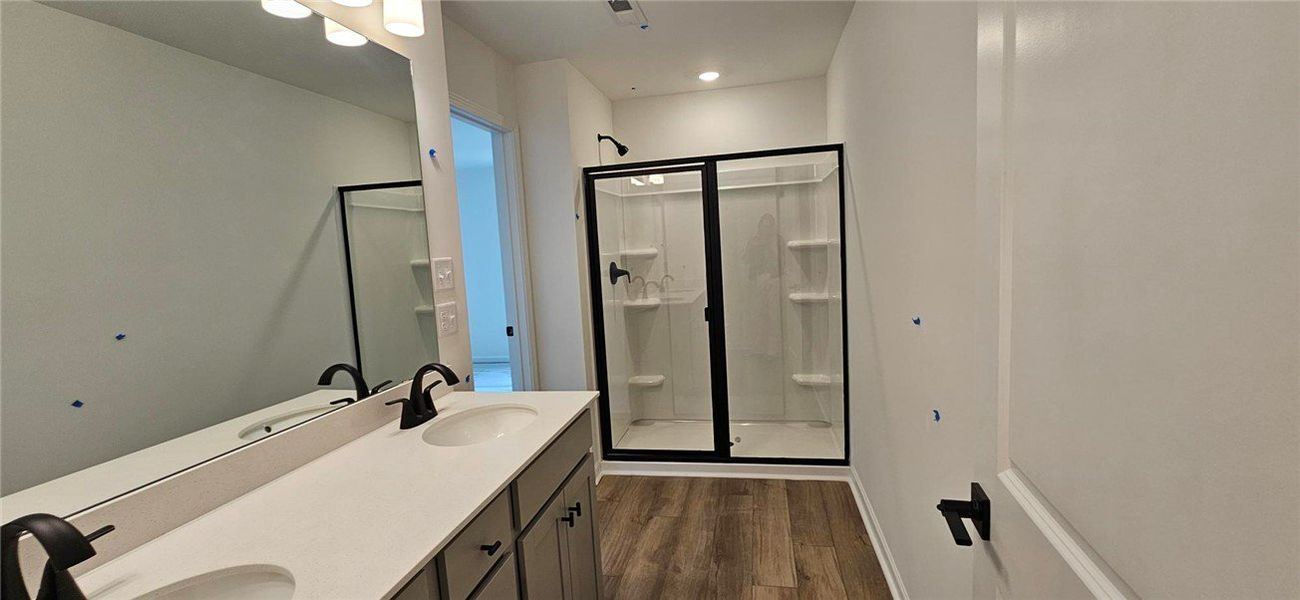 This newly constructed bathroom features a double This newly constructed bathroom features a double