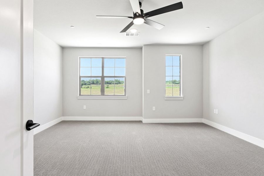 Spacious, unfurnished interior of a new home in The Tribute, The Colony (Image 33).