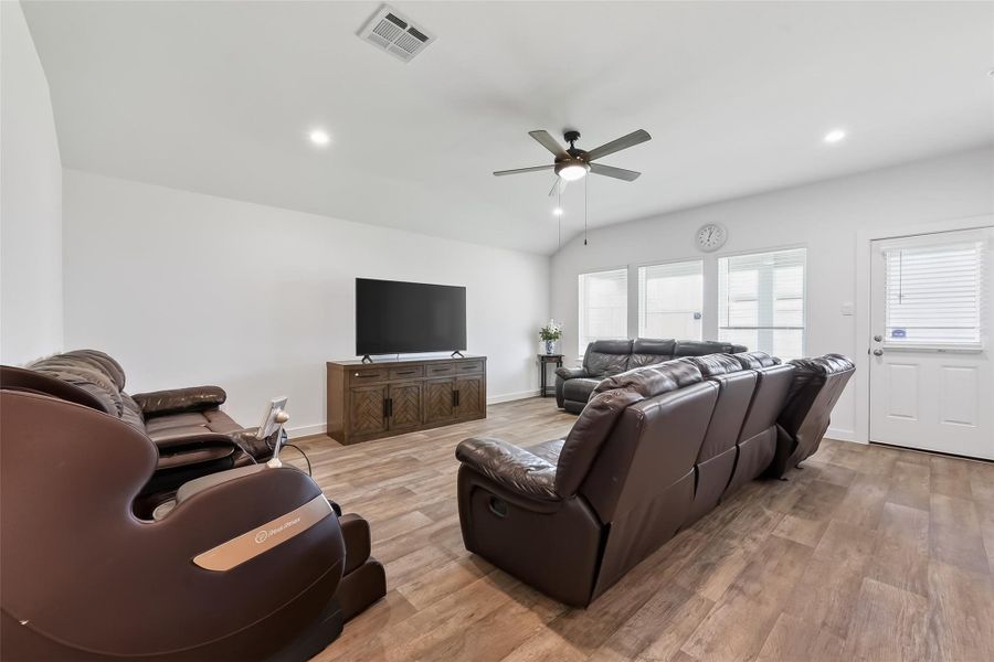 Spacious open-concept living and family room with an airy feel, perfect for hosting gatherings or enjoying quiet nights at home