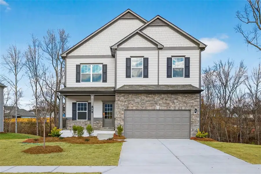 Front exterior of a new home in Garrett Preserve, Douglasville, GA, highlighting curb appeal (Image 1).